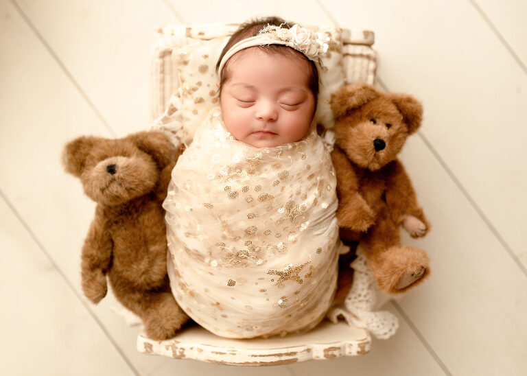 Frisco TX newborn photographer capturing baby girl newborn session