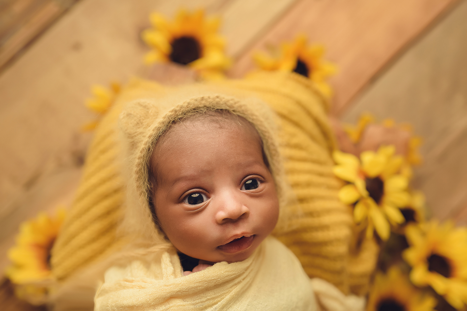 newborn in yellow setup