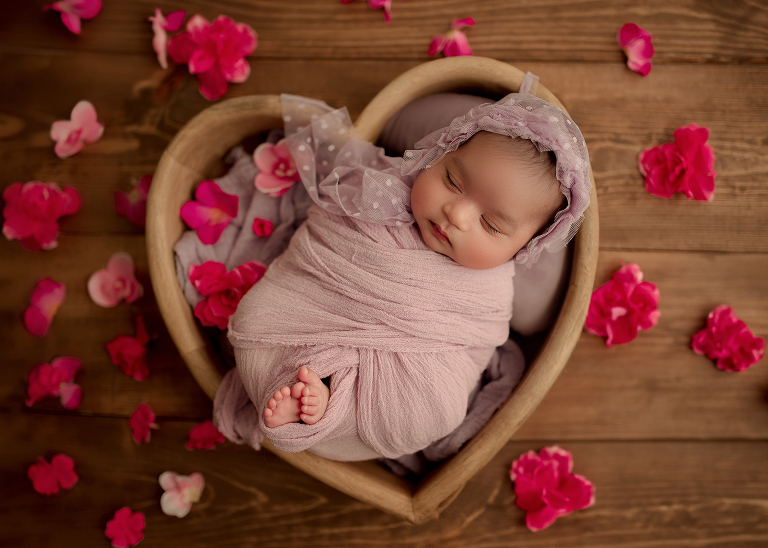 sleeping baby girl in purple