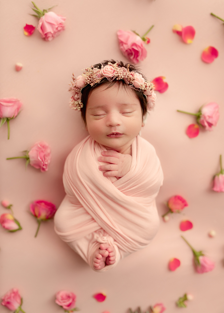 Professional newborn photographer in Allen TX capturing cozy portraits of baby girl