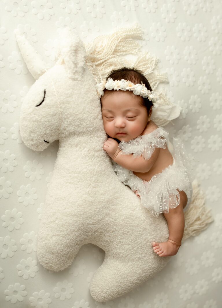 Frisco TX newborn photographer capturing baby girl newborn session
