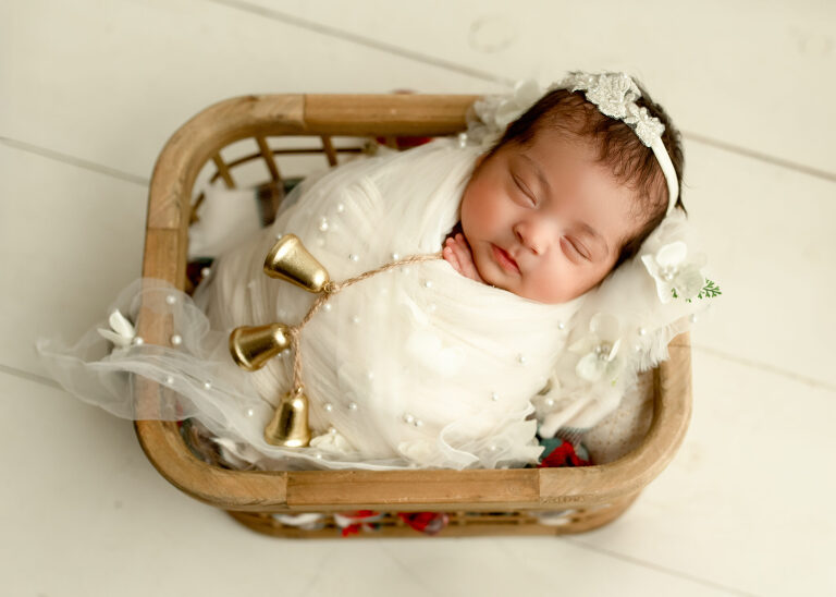 Frisco TX newborn photographer capturing baby girl newborn session