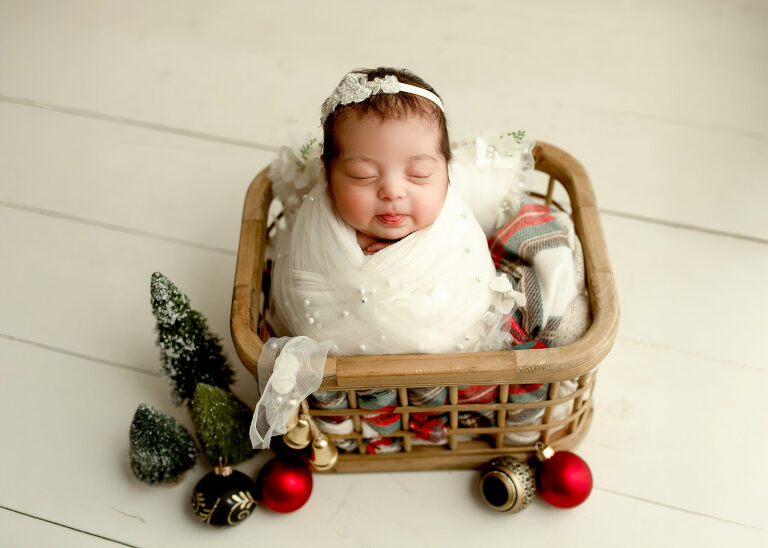 Frisco TX newborn photographer capturing baby girl newborn session