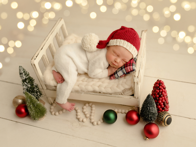Frisco TX newborn photographer capturing Christmas newborn baby boy session
