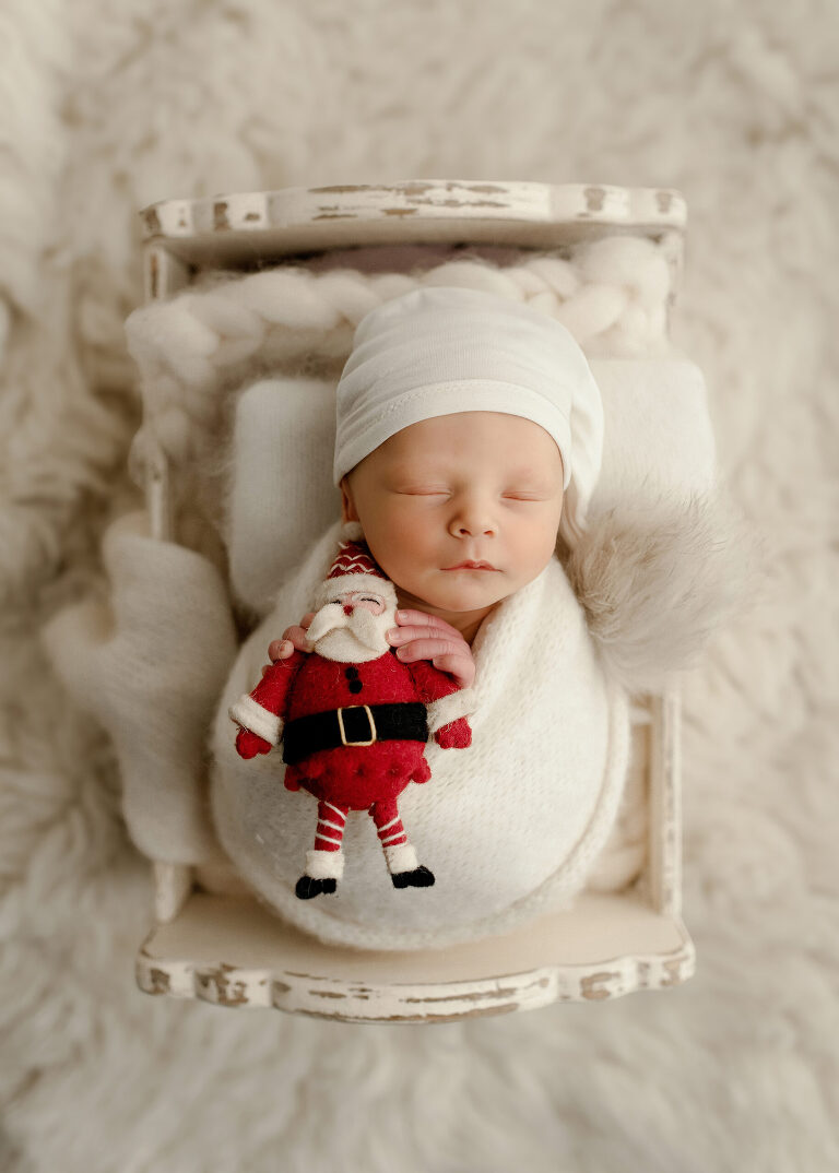 Frisco TX newborn photographer capturing Christmas newborn baby boy session