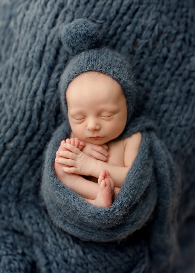 Frisco TX newborn photographer capturing Christmas newborn baby boy session